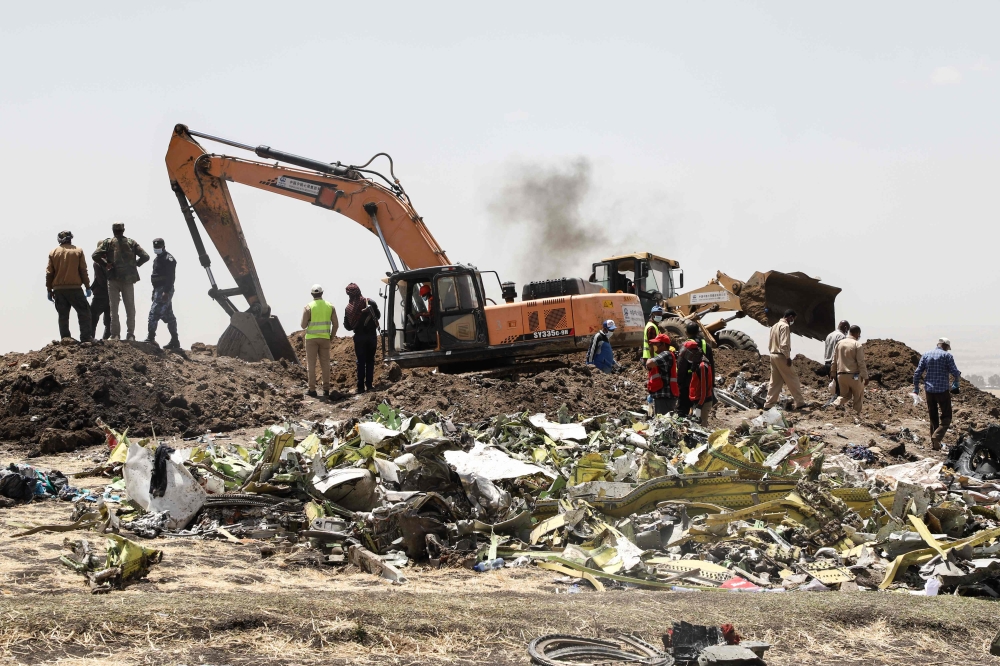 A power shovel digs at the crash site of Ethiopia Airlines near Bishoftu, a town some 60 kilometres southeast of Addis Ababa, Ethiopia, on March 11, 2019. AFP / Michael Tewelde 