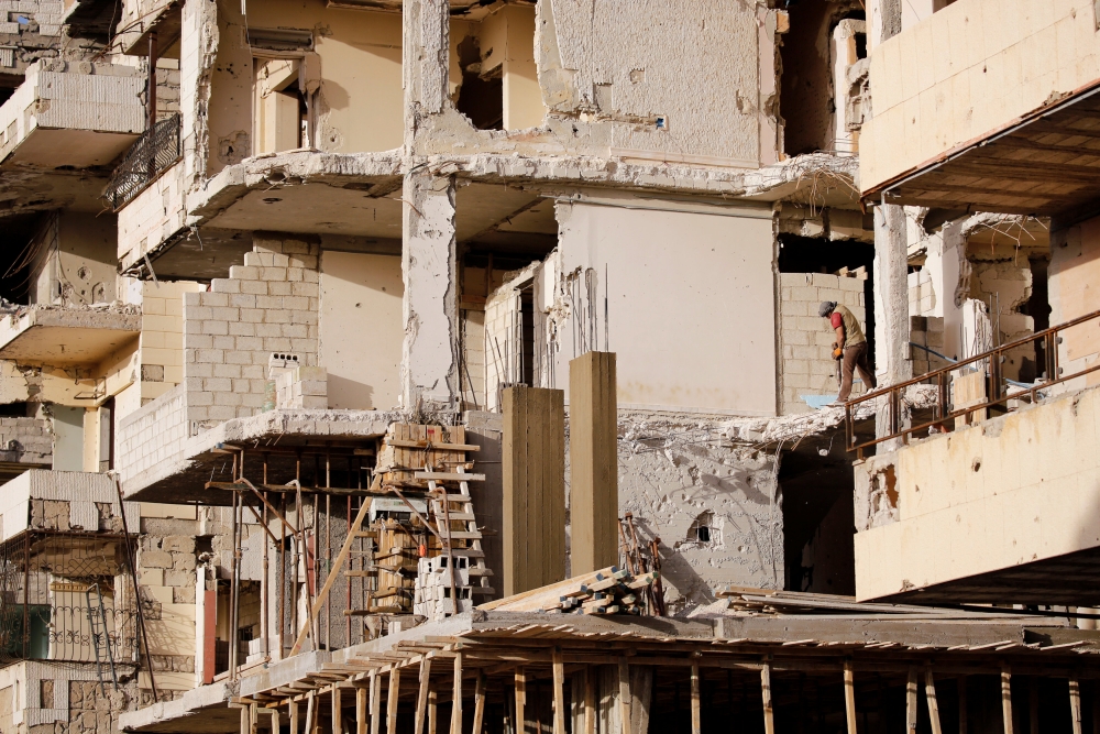 A worker works at a construction site in Ein Terma, a district of eastern Ghouta, Syria February 26, 2019. Picture taken February 26, 2019. REUTERS/Omar Sanadiki
