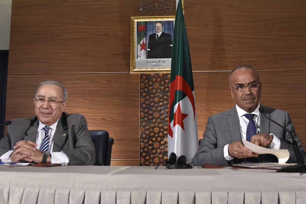 Newly appointed Algeria's prime minister Noureddine Bedoui (R) gives a joint press conference with his deputy Ramtane Lamamra in Algiers on March 14, 2019. AFP / RYAD KRAMDI