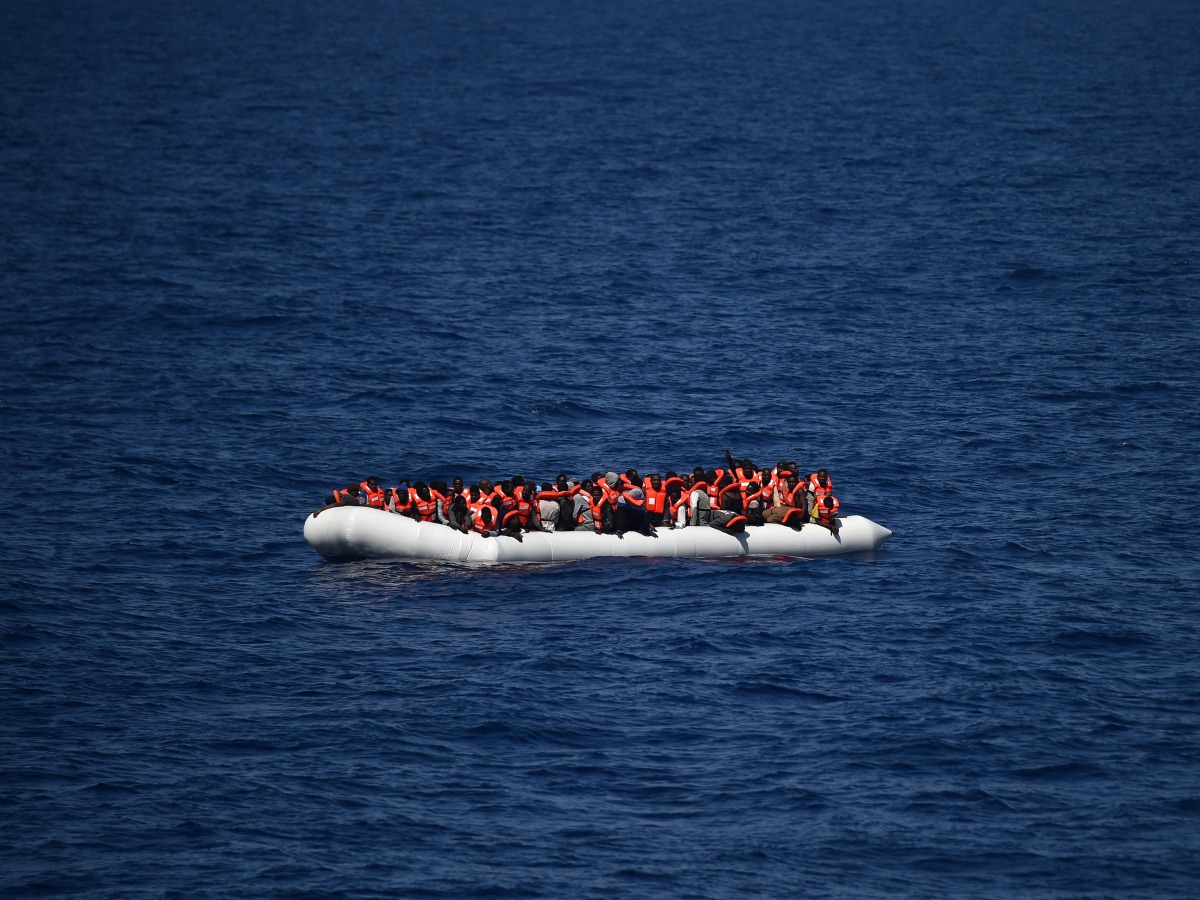 Refugees waiting on a rubber boat to be rescued during an operation at sea with the Aquarius ship now used by humanitarians on May, 24 2016 in the Mediterranean sea in front of the Libyan coast. AFP/Gabriel Bouys
 
