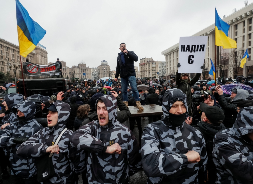 Activists attend a rally held by members of Ukrainian nationalist movements, who demand an investigation into top officials' activities suspected of corruption, in Kiev, Ukraine March 16, 2019. REUTERS/Gleb Garanich