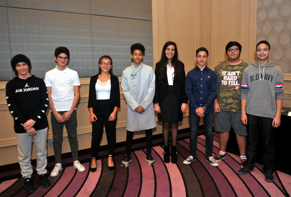 Students, who qualified for the final of First French Speech contest, pose for a group photo .