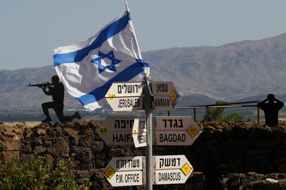 An Israeli flag is seen placed on Mount Bental in the Israeli-annexed Golan Heights on May 10, 2018. AFP/Jalaa Marey