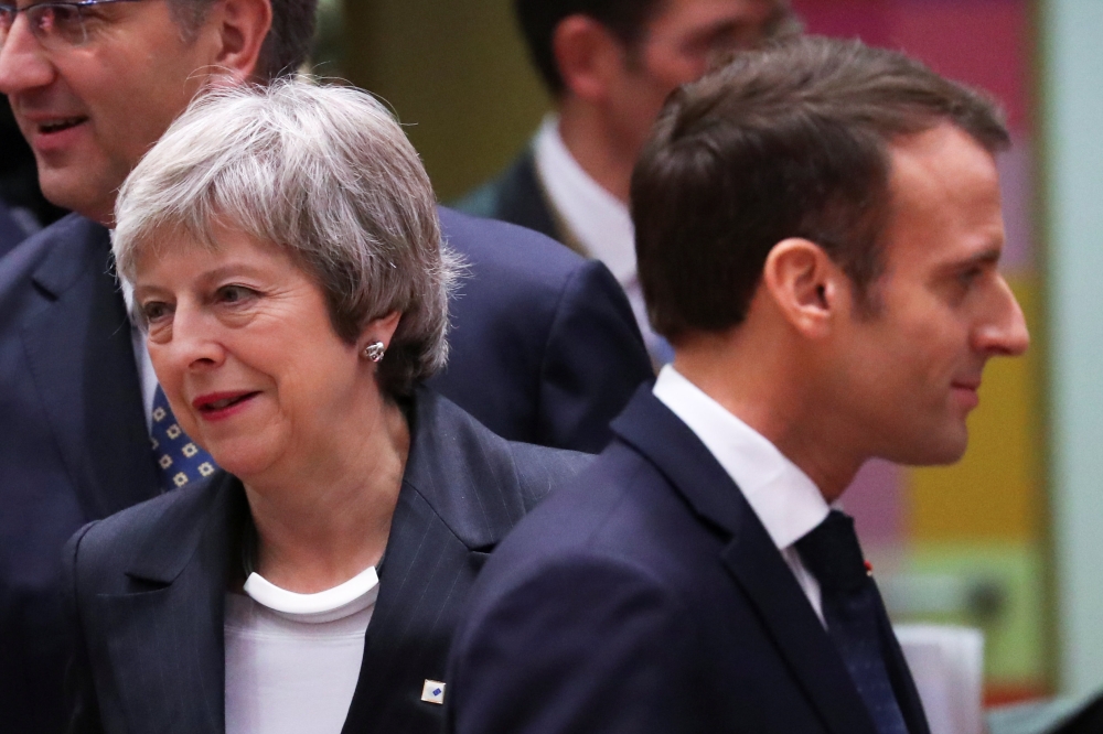  File photo: British Prime Minister Theresa May and French President Emmanuel Macron take part in a European Union leaders summit in Brussels, December 13, 2018. Reuters/Yves Herman