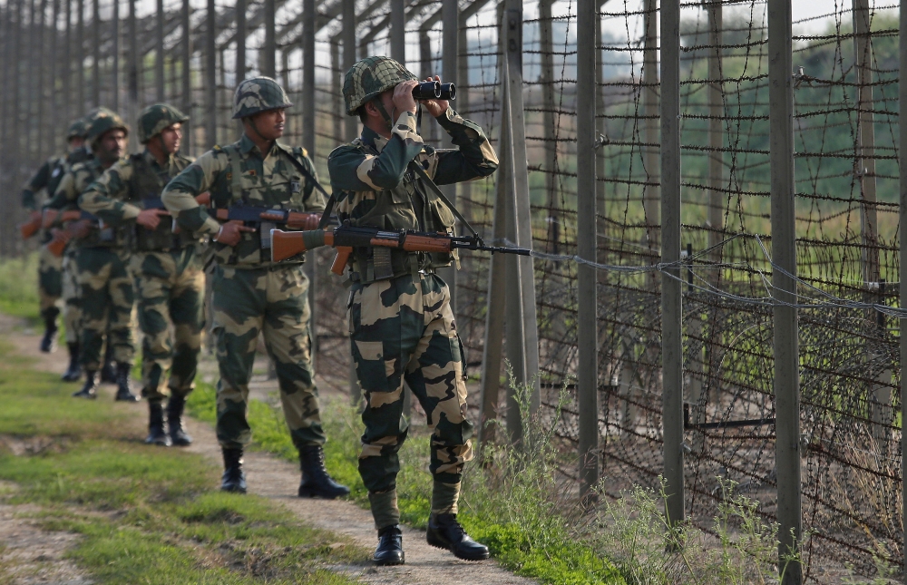FILE PHOTO: India's Border Security Force soldiers patrol along the fenced border with Pakistan in the Ranbir Singh Pura sector near Jammu February 26, 2019. REUTERS/Mukesh Gupta/File Photo
