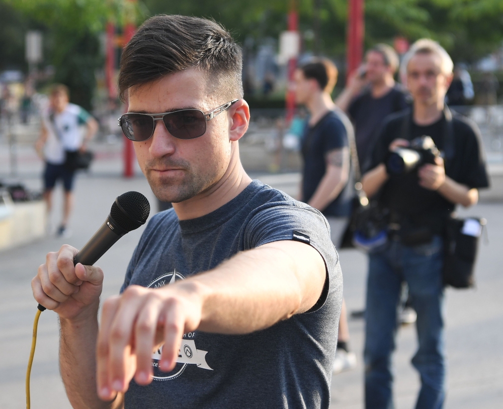 Martin Sellner, the local leader of the  Identitarian Movement (IBOe) far right group, speaking during a rally organised by IBOe in Vienna, Austria, on July 27, 2016. AFP / APA / Roland Schlager 