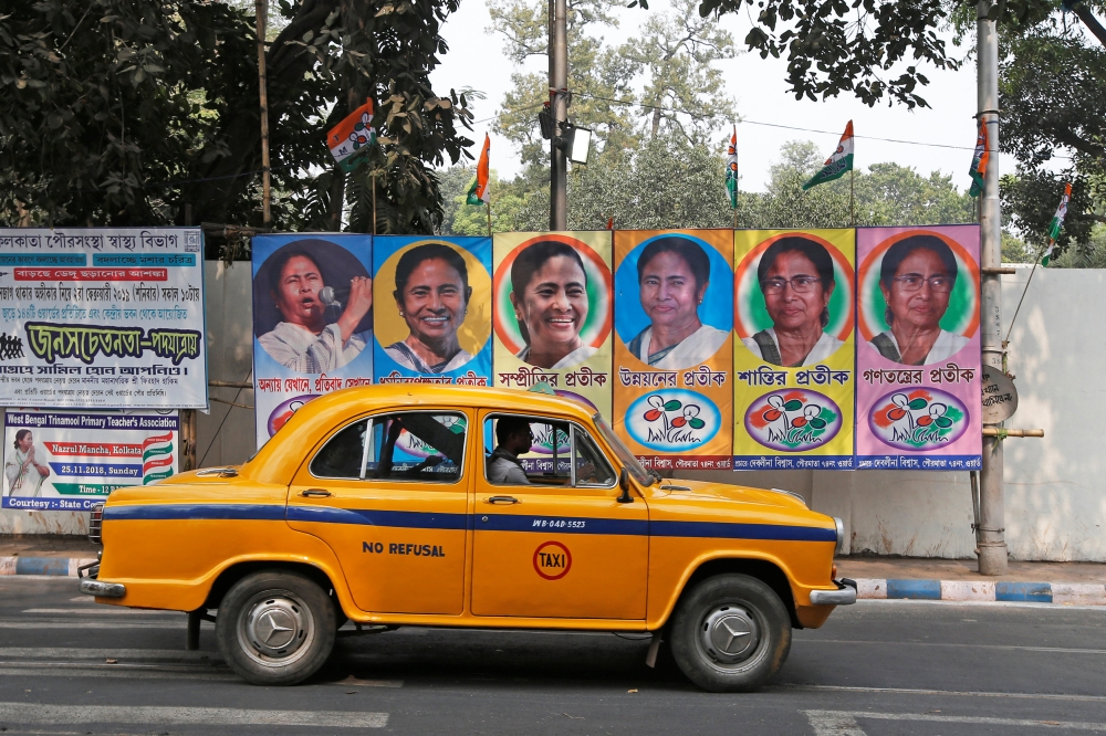 A taxi drives past a poster of Mamata Banerjee, Chief Minister of West Bengal state, in Kolkata, India, February 9, 2019.  Reuters/Rupak De Chowdhuri  