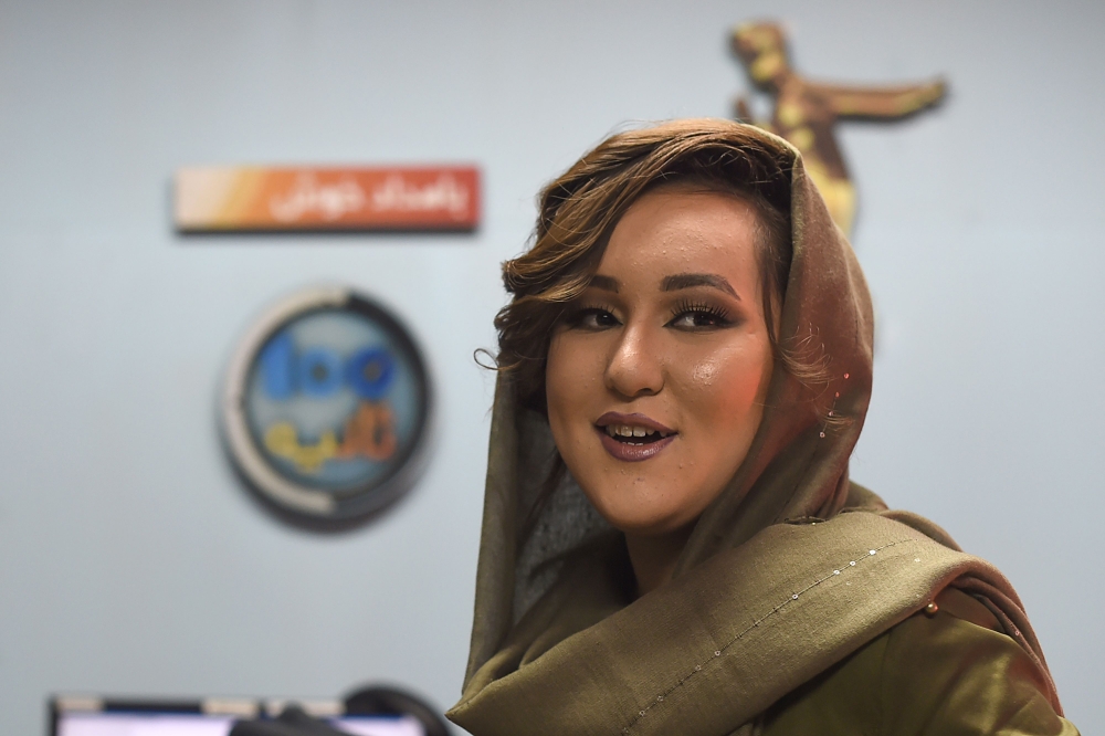 In this photo taken on March 28, 2019, Afghan singer Zahra Elham, who won the final of the television music competition Afghan Star, looks on during her interview with AFP in Kabul. AFP / WAKIL KOHSAR