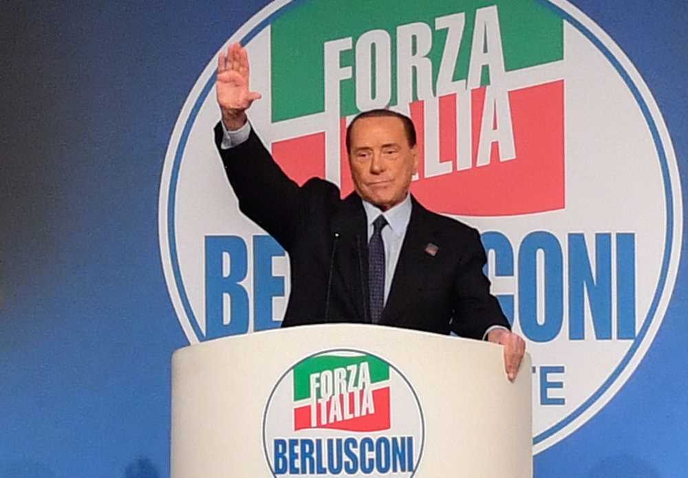 Former Italian prime minister Silvio Berlusconi gestures as he addresses a rally of right-wing Forza Italia party on March 30, 2019 at the Congress Center in Rome, ahead of the May 2019 European elections.  AFP / Andreas SOLARO