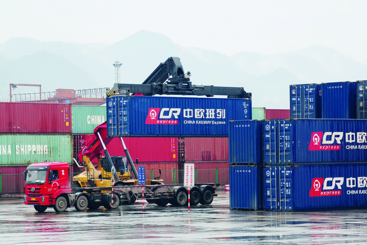 A crane lifts a China Railway Express container onto a truck at Chongqing railway port station, which serves as the start of a Belt and Road freight rail route linking Chongqing to Duisburg, China March 30, 2019. Picture taken March 30, 2019. Reuters