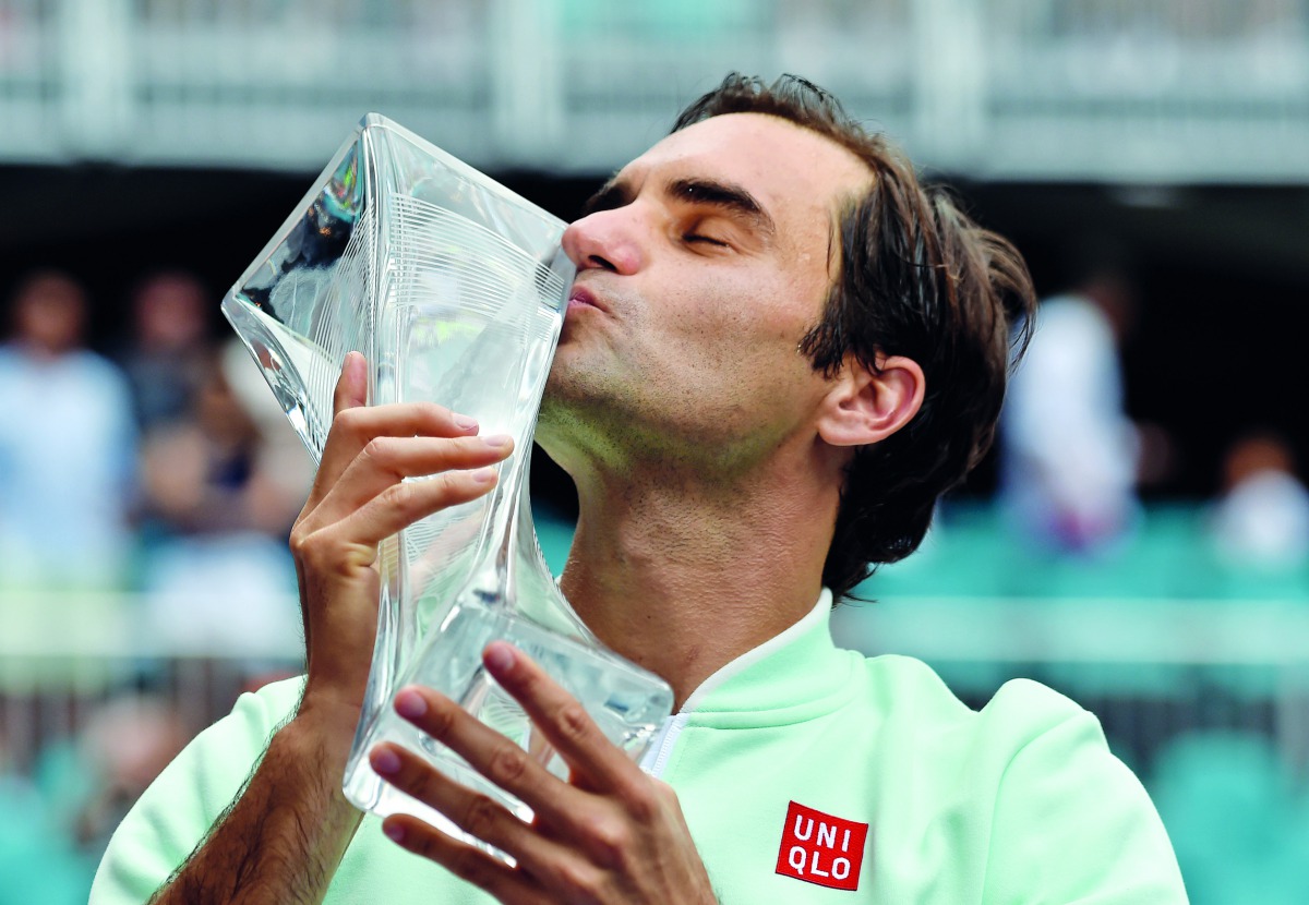 Roger Federer of Switzerland poses with the winners trophy after defeating John Isner in straight sets during the Men's Final match on day 14 of the Miami Open presented by Itau at Hard Rock Stadium on March 31, 2019 in Miami Gardens, Florida. Al Bello/Ge