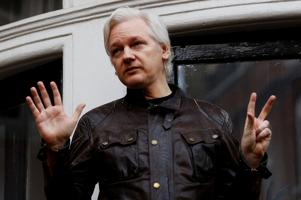 FILE PHOTO: WikiLeaks founder Julian Assange is seen on the balcony of the Ecuadorian Embassy in London, Britain, May 19, 2017. REUTERS/Peter Nicholls