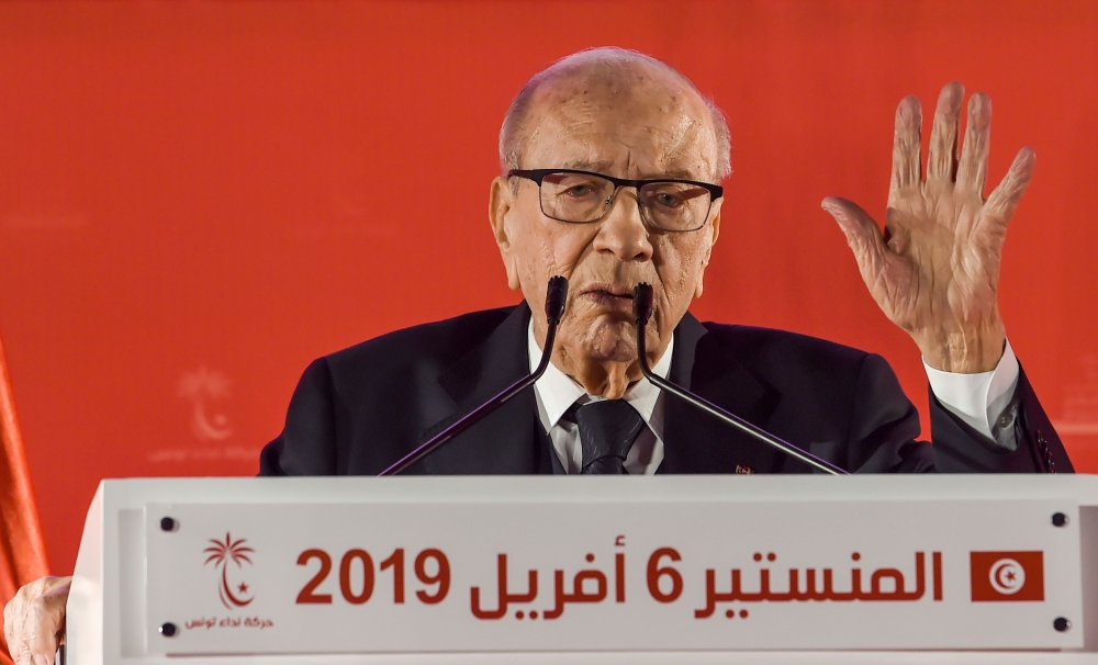 Tunisian President Beji Caid Essebsi waves to his supporters during the launch of his party Nidaa Tounes' congress in the coastal city of Monastir, about 160 kilometres south of the capital Tunis, on April 6, 2019. / AFP / FETHI BELAID