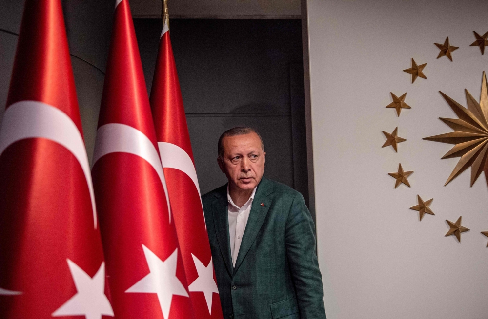 FILE PHOTO: In this file photo taken on March 31, 2019 Turkish President Tayyip Erdogan arrives at the news conference room at Huber Mansion in Istanbul, following local elections. AFP / BULENT KILIC
