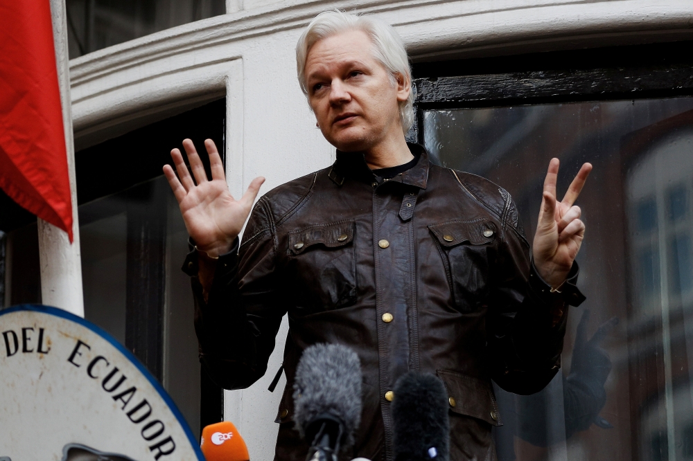FILE PHOTO: WikiLeaks founder Julian Assange is seen on the balcony of the Ecuadorian Embassy in London, Britain, May 19, 2017. REUTERS/Peter Nicholls/File Photo
 