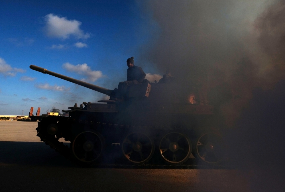 Members of Libyan National Army (LNA) commanded by Khalifa Haftar, get ready before heading out of Benghazi to reinforce the troops advancing to Tripoli, in Benghazi, Libya April 13, 2019. REUTERS/Esam Omran Al-Fetori