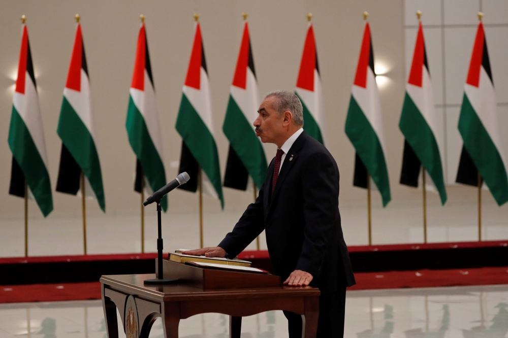 Mohammad Shtayyeh is sworn in as a Palestinian Prime Minister, in Ramallah in the Israeli-occupied West Bank April 13, 2019. Reuters/Mohamad Torokman