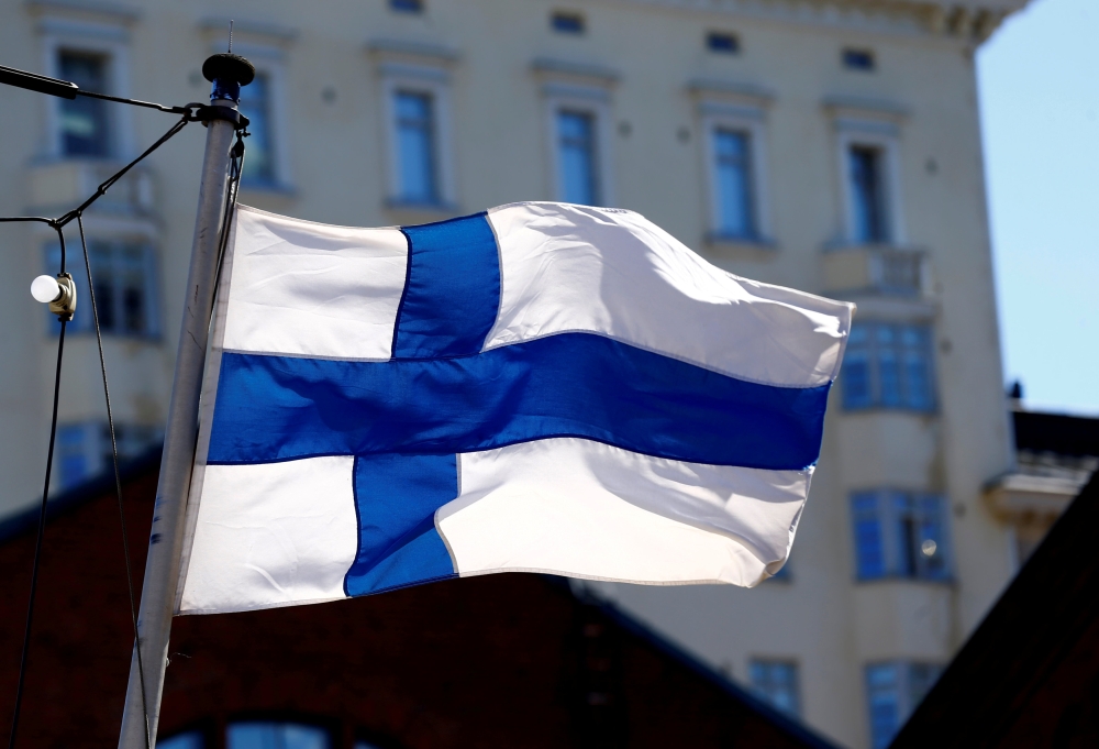 Finland flag flutters in Helsinki, May 3, 2017. Reuters/ Ints Kalnins