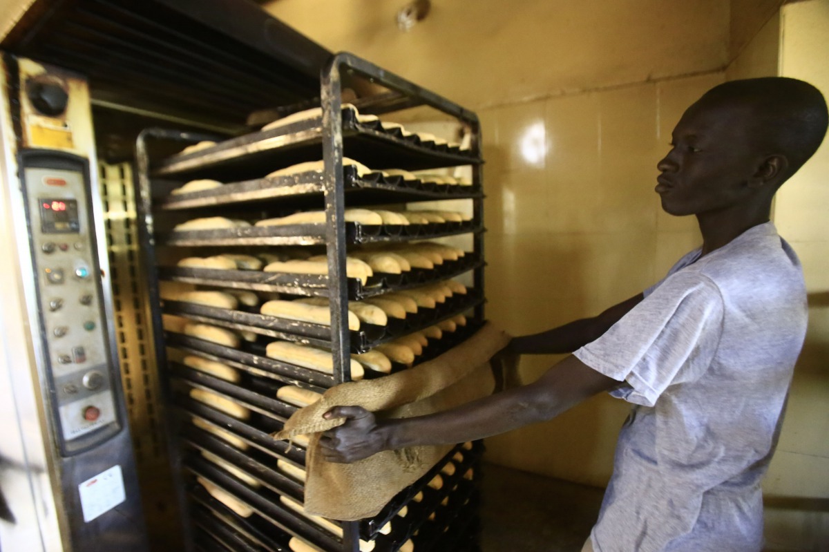 A Sudanese man works at a bakery in the capital Khartoum on January 5, 2018. AFP/Ashraf Shazly