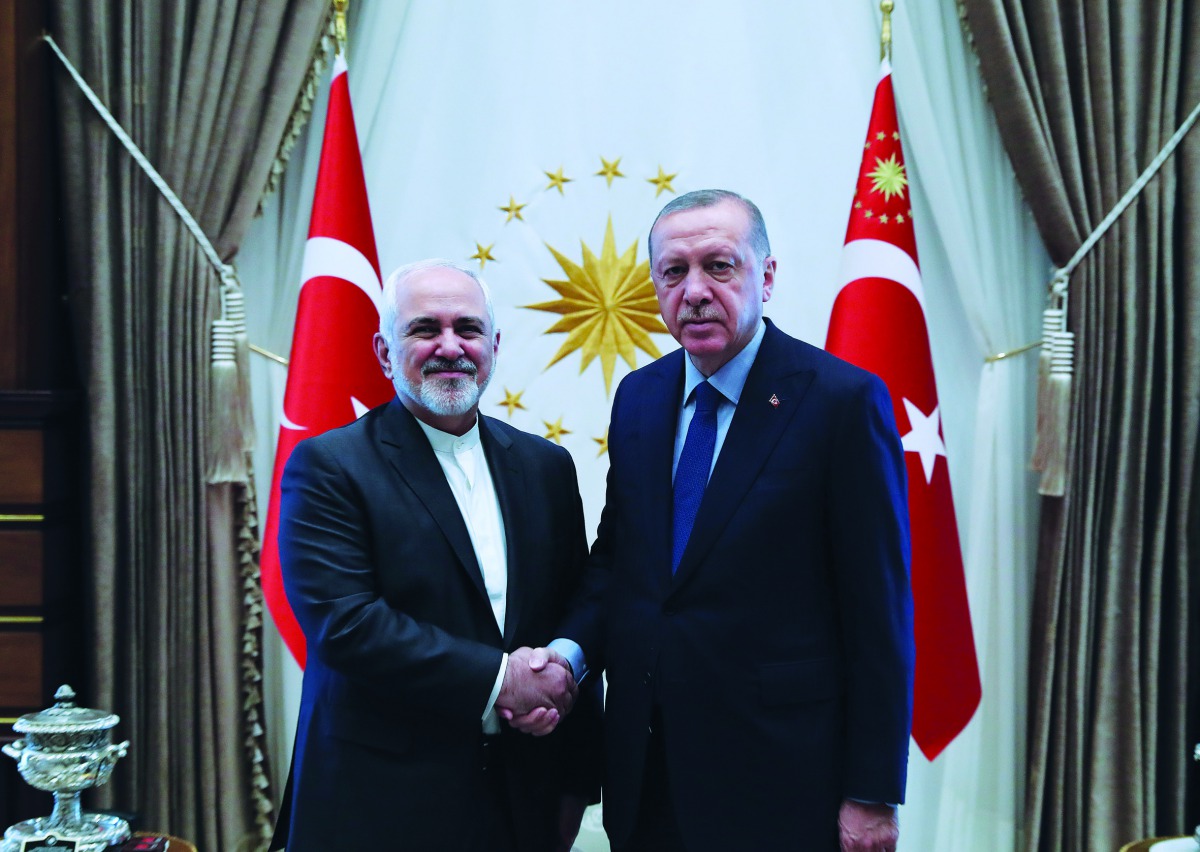 Turkish President Recep Tayyip Erdogan (R) meets Iranian Foreign Minister Mohammad Javad Zarif (L) in Ankara, Turkey on April 17, 2019. (Turkish Presidency/Cem Oksuz/Anadolu Agency) 