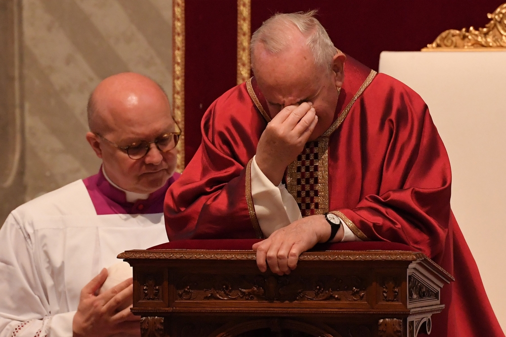Pope Francis prays during the Celebration of the Lord's Passion on Good Friday at St Peter's Basilica, on April 19, 2019 in the Vatican. AFP / Tiziana Fabi
 