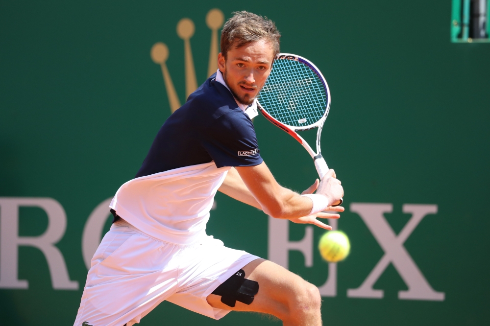 Russia's Daniil Medvedev hits a return to Serbia's Dusan Lajovic during the semi final tennis match of the Monte-Carlo ATP Masters Series tournament in Monaco on April 20, 2019. / AFP / VALERY HACHE