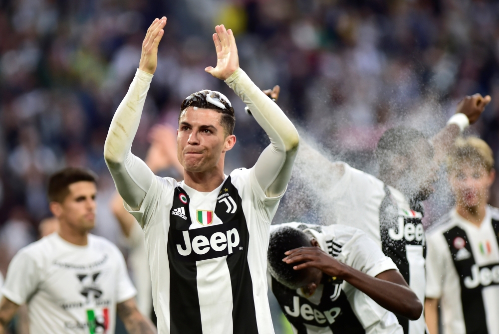 Juventus' Cristiano Ronaldo celebrates winning the league after the match REUTERS/Massimo Pinca