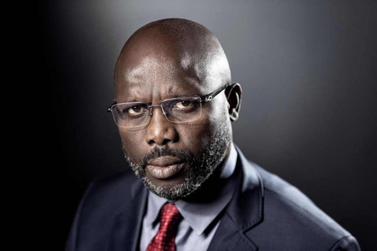 This file photo taken on September 25, 2017 shows former football player and candidate in Liberia's presidential elections, George Weah posing during a photo session in Paris. AFP / Joel Saget 
