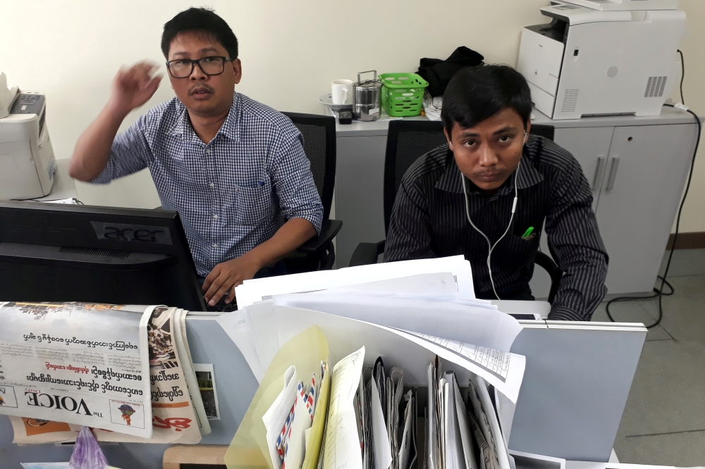Reuters journalists Wa Lone and Kyaw Soe Oo, who were based in Myanmar, pose for a picture at the Reuters office in Yangon, December 11, 2017. Reuters/Antoni Slodkowski