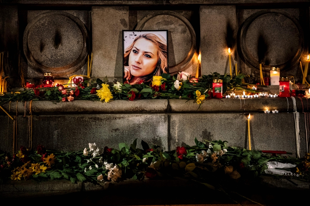 A portrait of slain Bulgarian television journalist Viktoria Marinova during a candle-light vigil in the city of Rousse on October 8, 2018. AFP/Dimitar Dilkoff