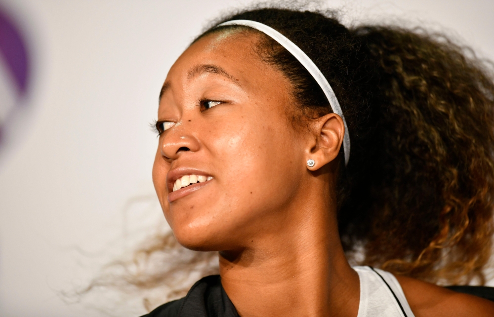 Japan's tennis player Naomi Osaka gives a press conference on April 23, 2019 at the WTA Tennis Grand Prix in Stuttgart, southwestern Germany. / AFP / THOMAS KIENZLE
