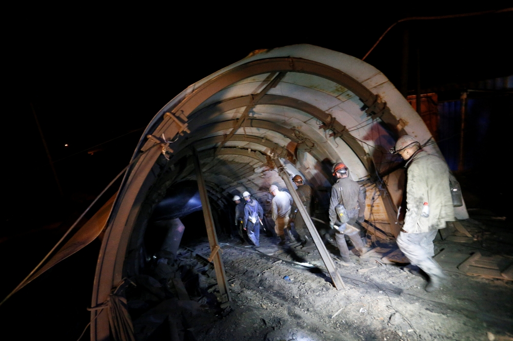 Employees walk at the coal mine of Skhidkarbon company following an alleged methane explosion near the separatist-controlled city of Luhansk, Ukraine April 26, 2019. REUTERS/Alexander Ermochenko