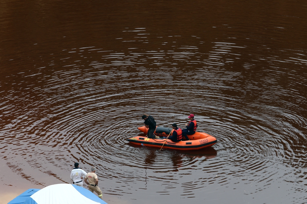 Forensic officers search Kokkinopezoula lake, also known as 