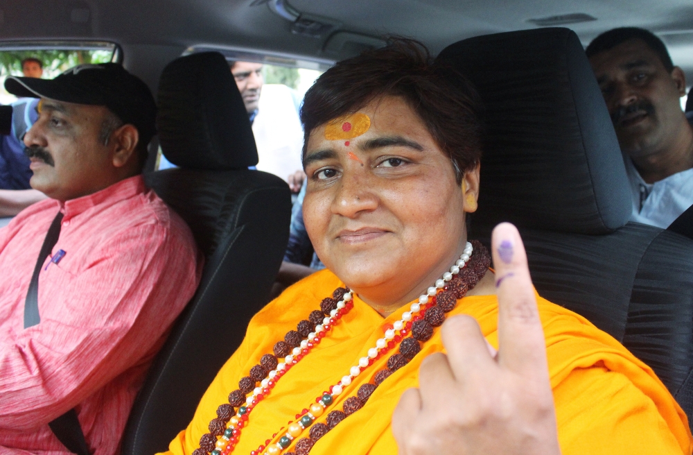 Pragya Singh Thakur, leader of ruling Bharatiya Janata Party (BJP), shows her ink-marked finger after casting her vote, outside a polling station in Bhopal, India, May 12, 2019. (REUTERS/Raj Patidar)