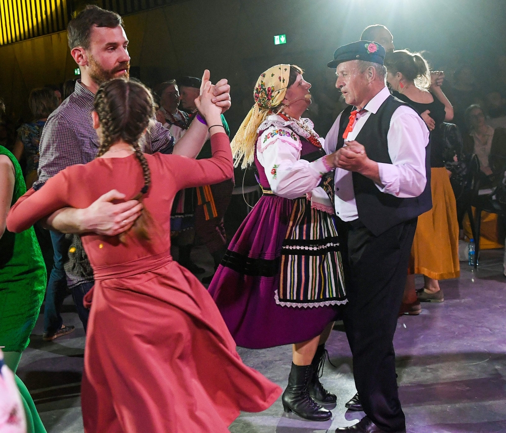 A Polish couple dressed in traditional costumes and others dance the country's mazurka folk dance in Warsaw on April 26, 2019.  AFP / Janek Skarzynski