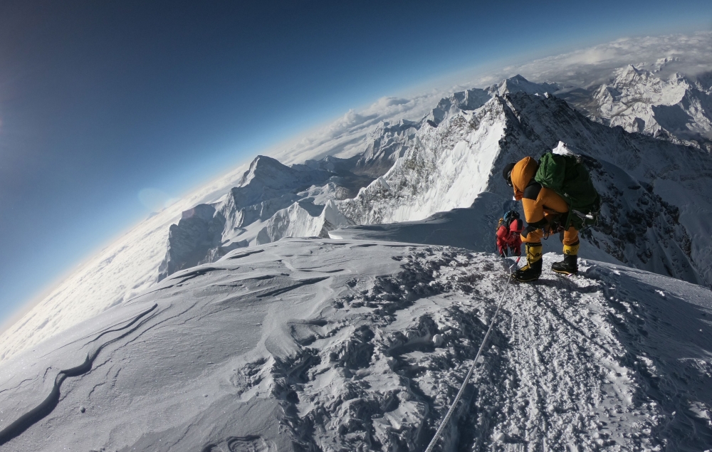 FILE PHOTO:  In this file photo taken on May 17, 2018, mountaineers make their way to the summit of Mount Everest, as they ascend on the south face from Nepal. AFP / Phunjo LAMA