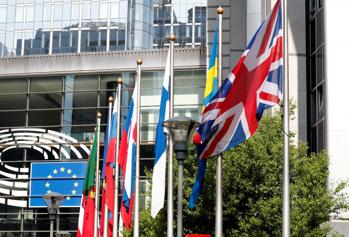 Flag flie at the entrance of the European Parliament in Brussels, Belgium, March 28, 2017. Reuters/Yves Herman