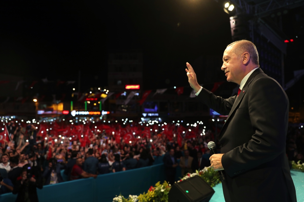 President of Turkey Recep Tayyip Erdogan greets people as he attends a program on the occasion of Laylat al-Qadr in Esenler district of Istanbul, Turkey on May 31, 2019 Turkish Presidency / Kayhan Ozer
