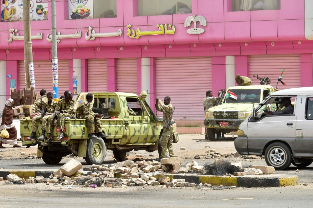 Sudanese soldiers stand guard a street in Khartoum on June 9, 2019. Sudanese police fired tear gas Sunday at protesters taking part in the first day of a civil disobedience campaign, called in the wake of a deadly crackdown on demonstrators. AFP 