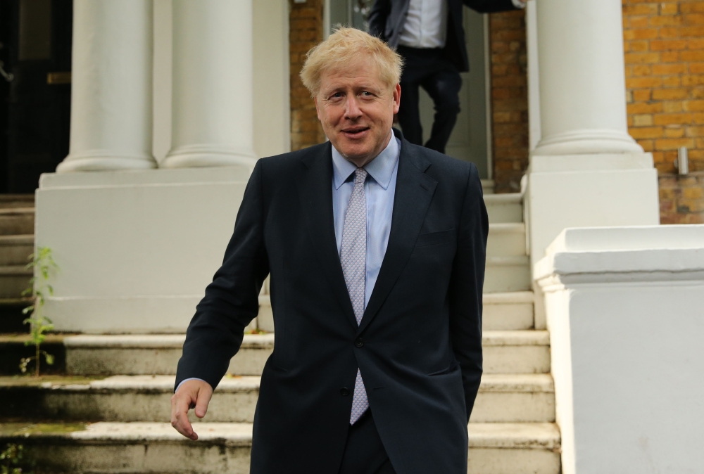 Conservative MP Boris Johnson leaves his home in London on June 11, 2019. AFP / Isabel Infantes 