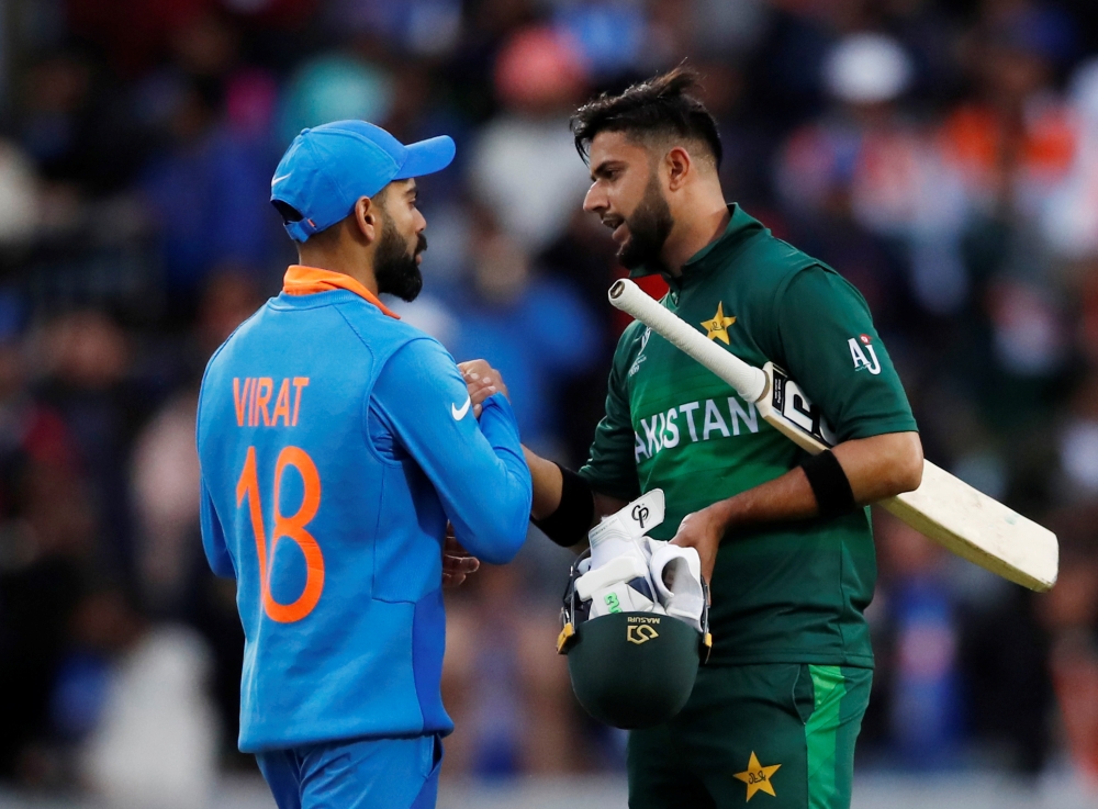  India's Virat Kohil shakes hands with Pakistan's Shadab Khan after the match Action Images via Reuters/Andrew Boyers