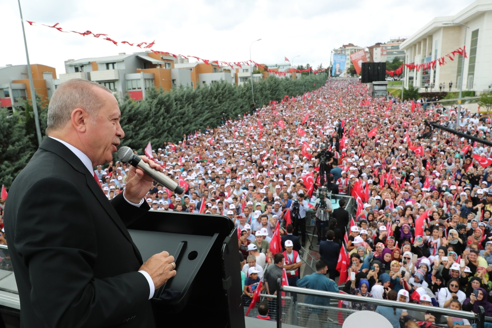 Turkish President Recep Tayyip Erdogan addresses the crowd during the mass opening ceremony in front of Sancaktepe Municipality in Istanbul, Turkey on June 19, 2019.  Anadolu 