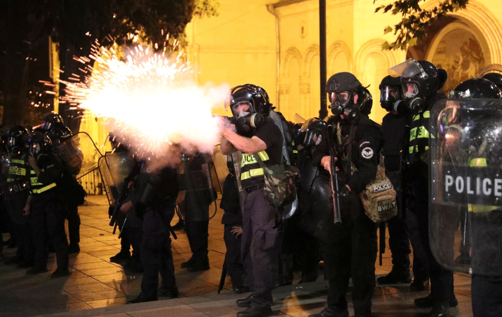 A riot policeman fires during a rally against a Russian lawmaker's visit in Tbilisi, Georgia June 21, 2019. Reuters/Irakli Gedenidze