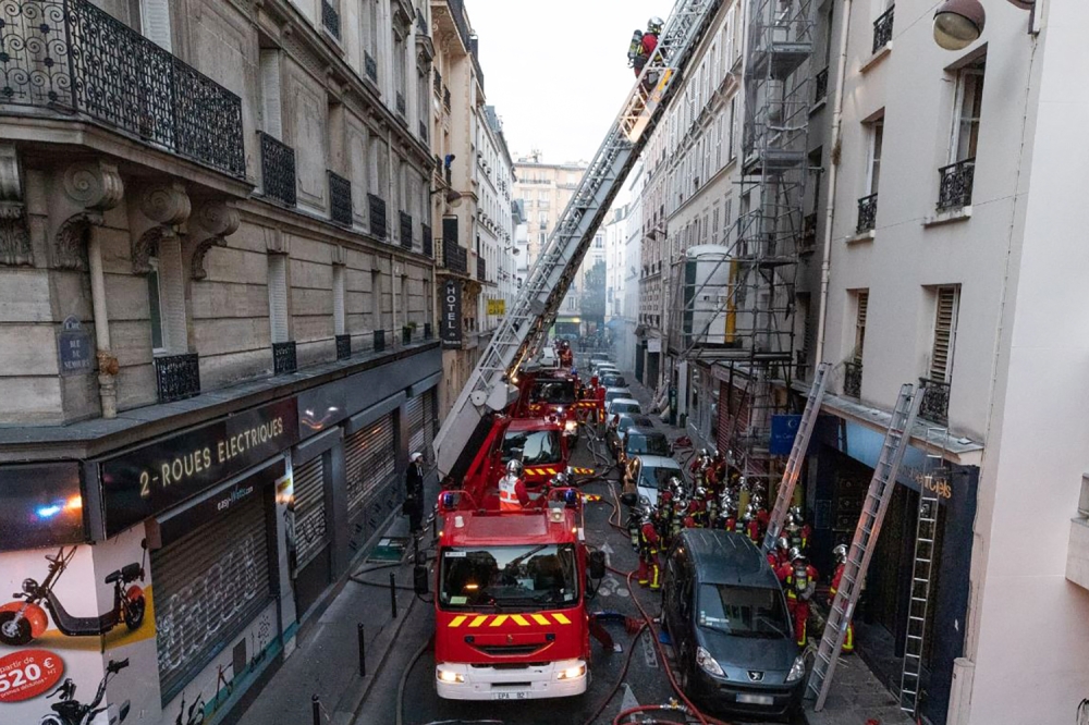 Firefighters working on the site of a fire that broke out in a building rue de Nemours in Paris, where three people died and another was seriously injured in a fire that broke out early in the morning.