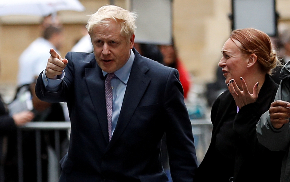 FILE PHOTO: Boris Johnson arrives at BBC studios to take part in a TV debate with candidates campaigning to replace British Prime Minister Theresa May, in London, Britain June 18, 2019. REUTERS/Peter Nicholls/File Photo