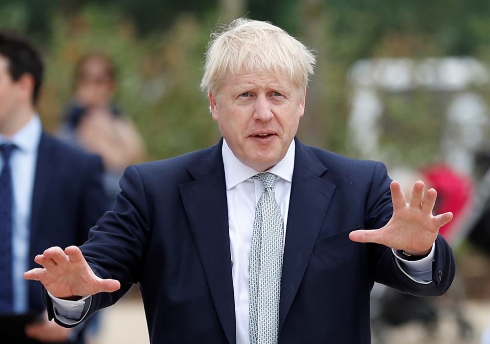 Boris Johnson, a leadership candidate for Britain's Conservative Party, arrives for a walkabout at Wisley Garden Centre in Surrey, Britain, June 25, 2019. REUTERS/Peter Nicholls