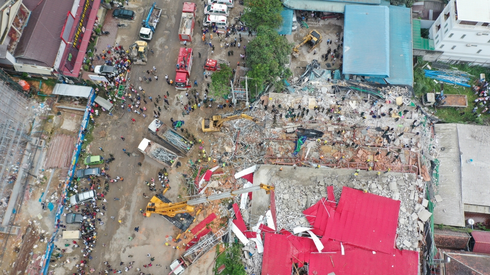 An overhead view of a collapsed under-construction building in Sihanoukville, Cambodia June 22, 2019. Reuters/Stringer