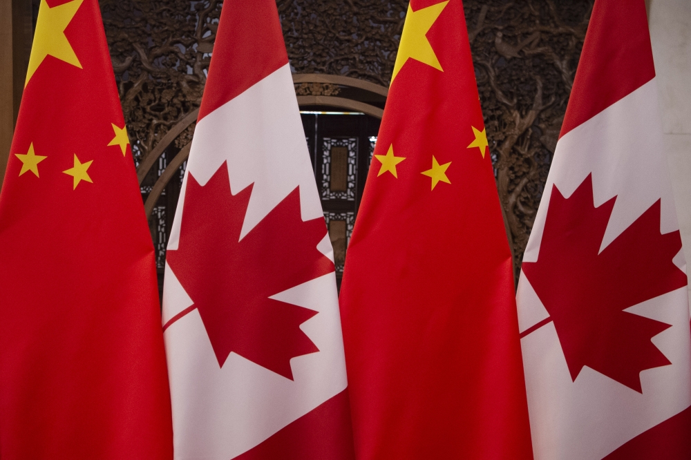 In this file photo taken on December 5, 2017 shows Canadian and Chinese flags taken prior to a meeting with Canada's Prime Minister Justin Trudeau and China's President Xi Jinping at the Diaoyutai State Guesthouse in Beijing. AFP / Fred Dufour
 