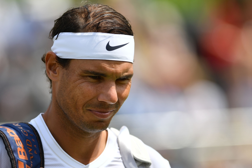 Spain's Rafael Nadal reacts as he arrives for his men's singles match against Croatia's Marin Cilic at The Aspall Tennis Classic tournament at the Hurlingham Club in London on June 26, 2019. / AFP / Daniel LEAL-OLIVAS