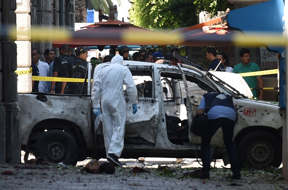 Police officers are seen at the site of an explosion in downtown Tunis, Tunisia, June 27, 2019. REUTERS/Zoubeir Souissi